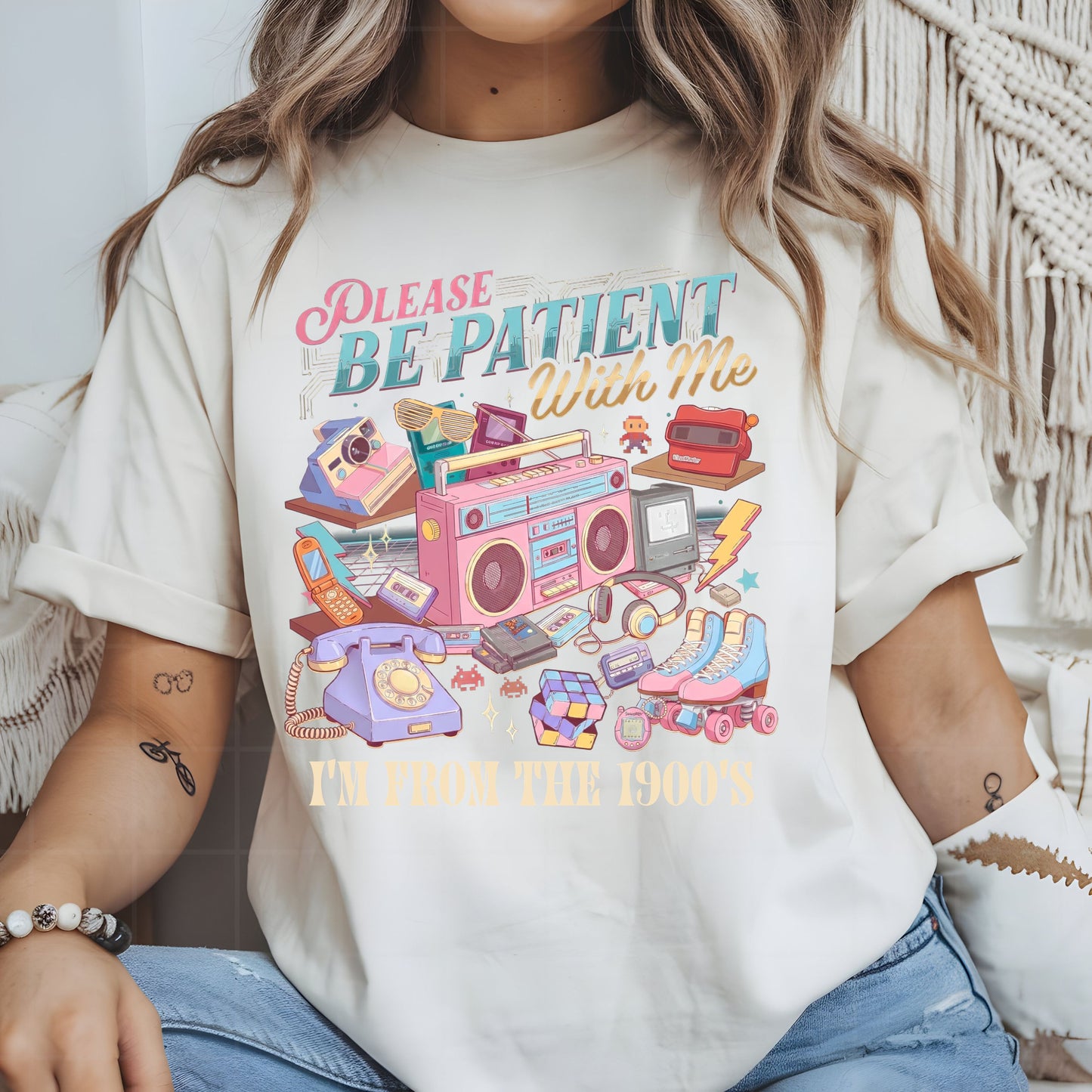 Person wearing a t-shirt with a retro-themed graphic and text.