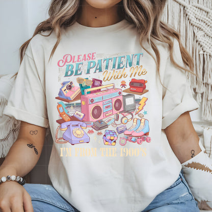 Person wearing a t-shirt with a retro-themed graphic and text.