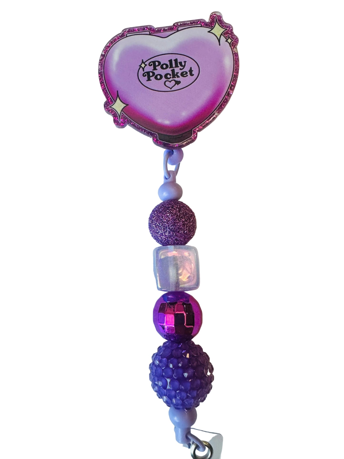 Purple heart-shaped clip with decorative beads on a white background