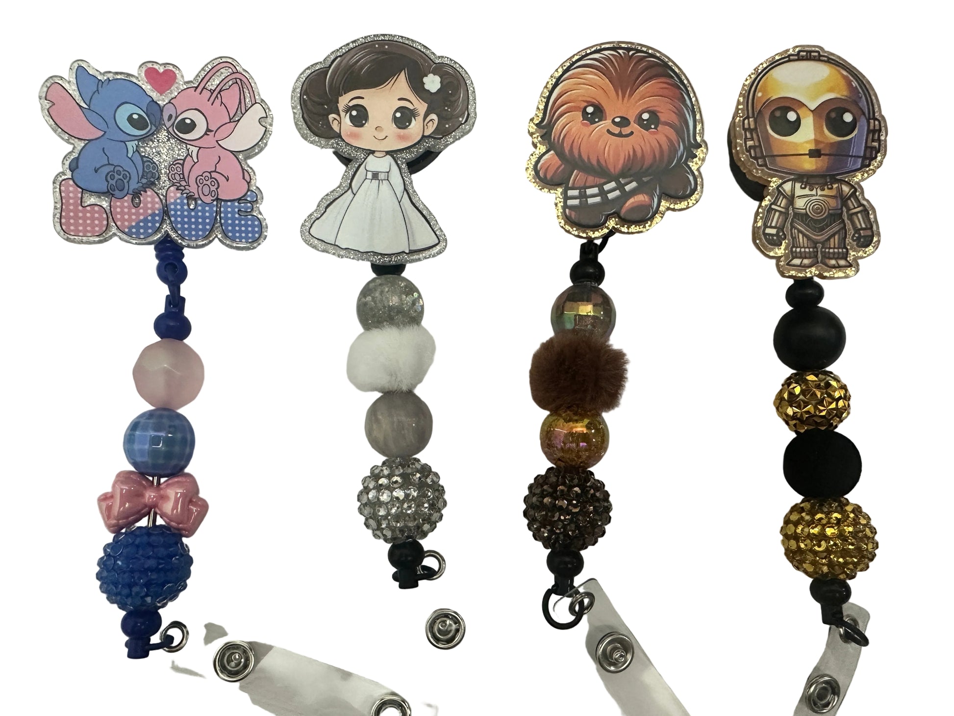 Collection of character-themed badge holders with beads on a white background
