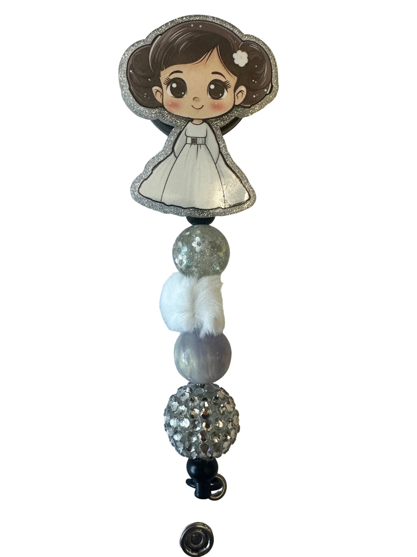Decorative item with cartoon character and beads on a neutral background