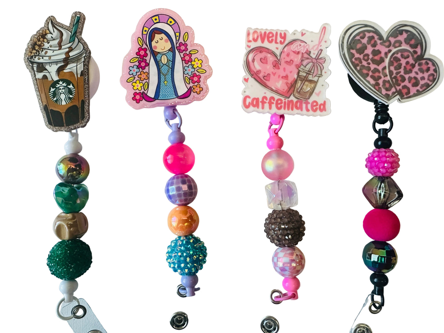 Colorful beaded keychains with decorative charms on a light background