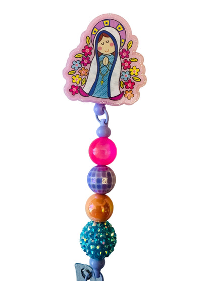 Colorful bead necklace with a decorative clip featuring a cartoon character on a light gray background
