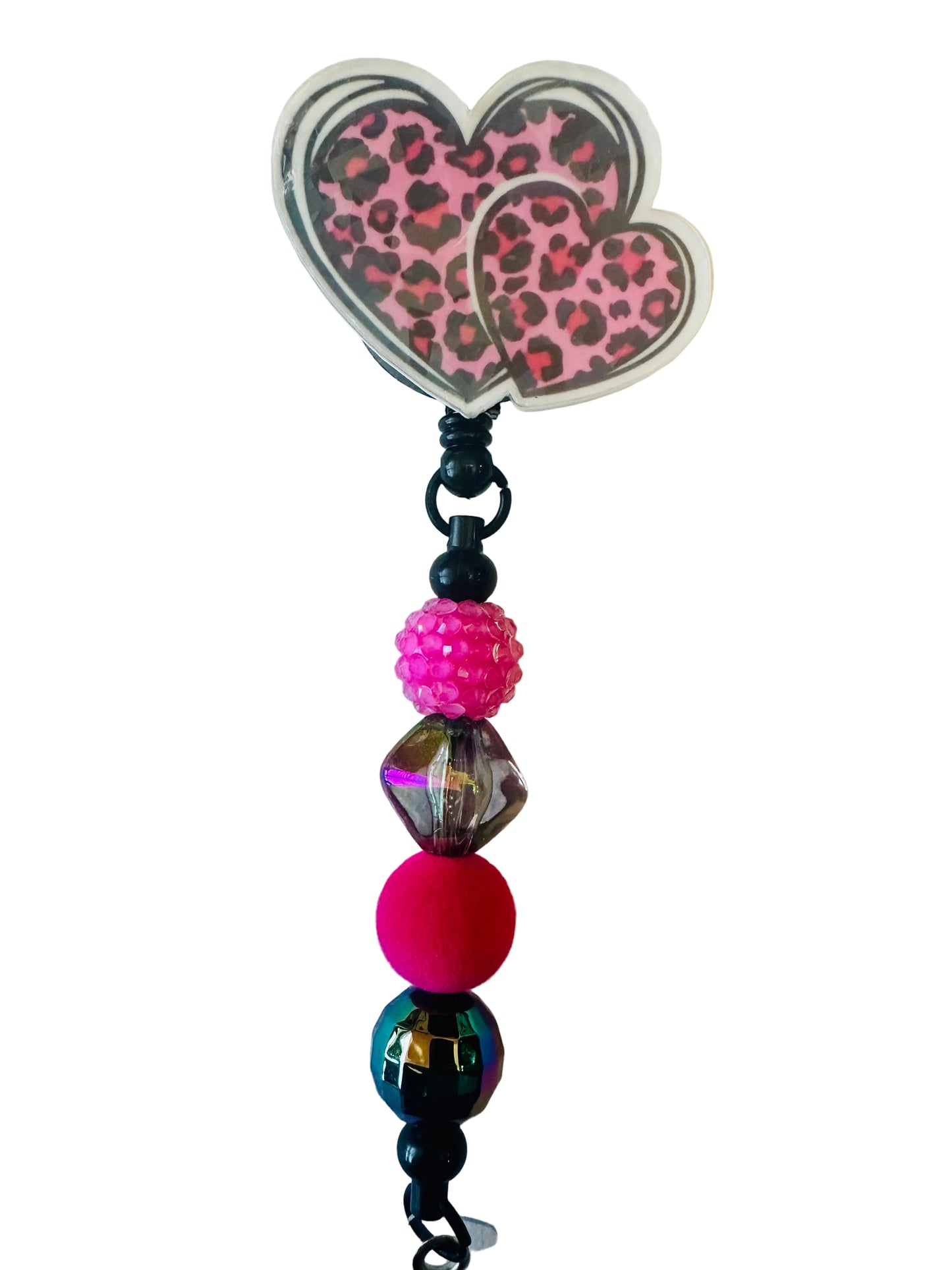 Beaded charm with a pink leopard print butterfly on a light background