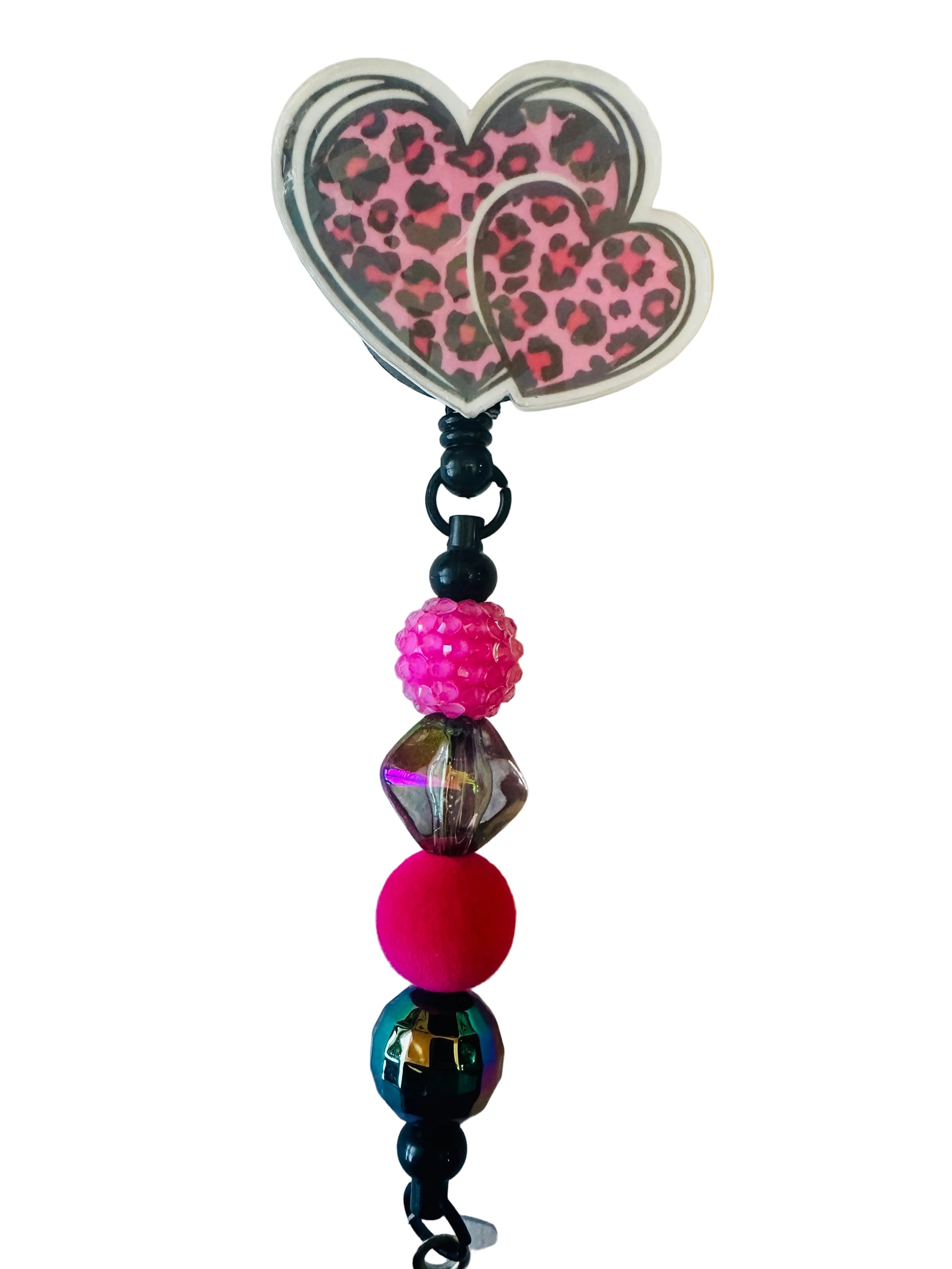 Beaded charm with a pink leopard print butterfly on a light background